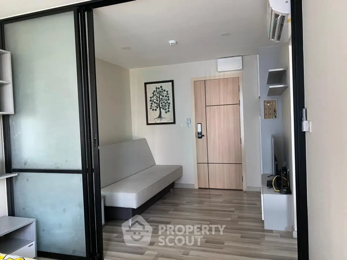 Modern living room with sliding glass doors and minimalist decor