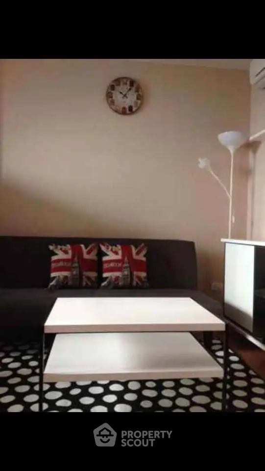 Stylish living room with modern decor and unique clock accent