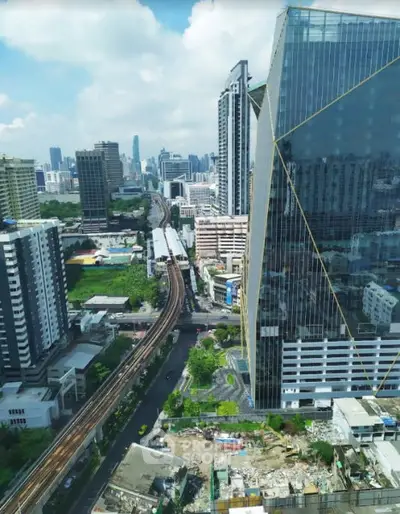 Stunning cityscape view from a high-rise building showcasing urban architecture and skyline.
