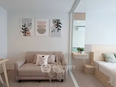 Modern living room with stylish decor and cozy sofa in a contemporary apartment.