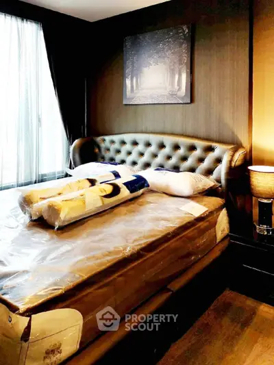 Luxurious bedroom with elegant decor and plush bedding in a modern apartment.