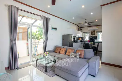 Modern living room with open kitchen and stylish decor