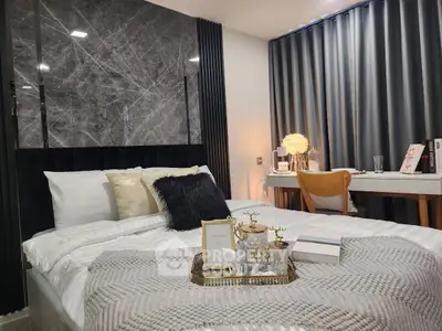 Luxurious bedroom with elegant decor and cozy ambiance, featuring a stylish bed and modern study area.