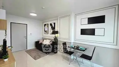 Modern living room with stylish decor and dining area in open layout apartment.