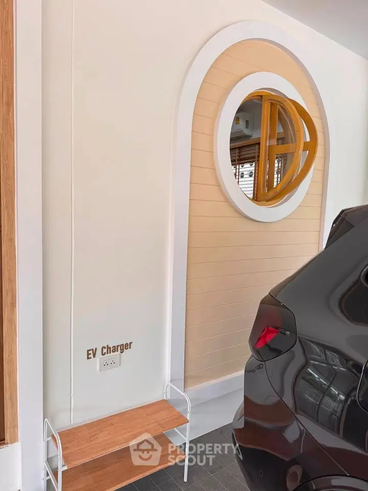 Modern garage with EV charger and stylish window design