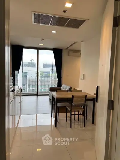 Modern living room with dining area and large window view