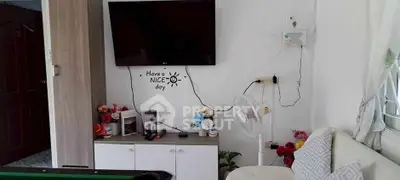 Cozy living room with wall-mounted TV and stylish decor