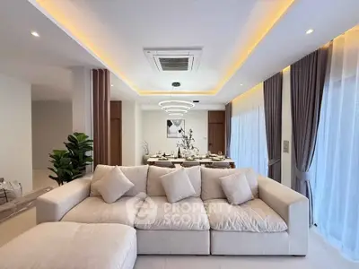 Luxurious modern living room with elegant lighting and plush beige sofa