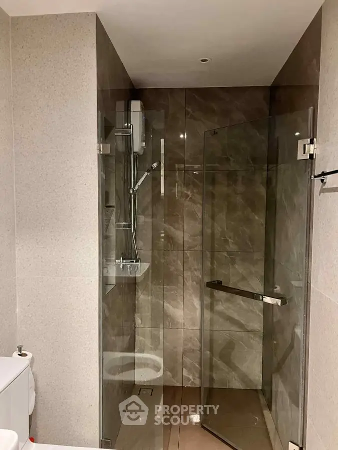 Modern bathroom with glass shower enclosure and sleek design