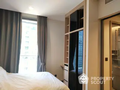 Cozy bedroom with natural light, built-in wardrobe, and modern design, perfect for relaxation and comfort in a prime location.