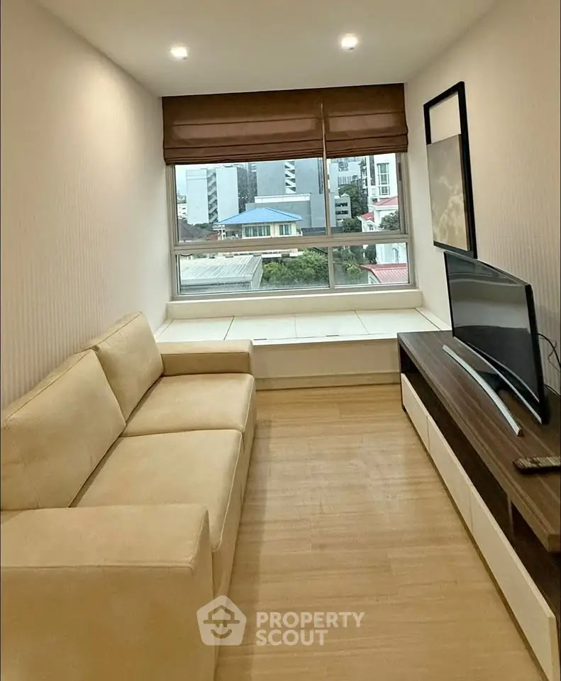 Cozy living room with modern sofa and city view window