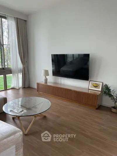 Modern living room with sleek TV setup and elegant decor