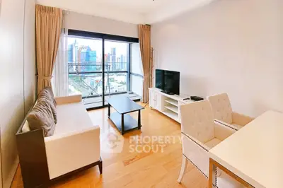 Spacious living room with city view, elegant furniture, and large windows in modern apartment.