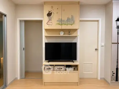 Modern living room with stylish TV cabinet and artistic wall decor