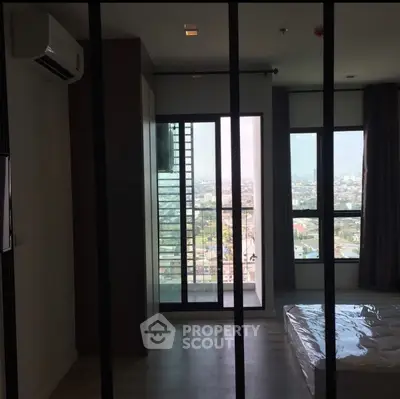 Modern apartment with large windows offering stunning city views