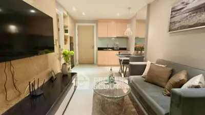 Modern living room with sleek furniture and open kitchen layout, perfect for stylish urban living.