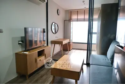 Modern living room with stylish wooden furniture and large window for natural light.