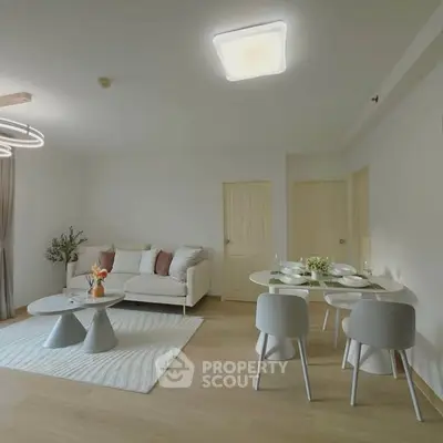 Spacious modern living room with elegant dining area and cozy seating.