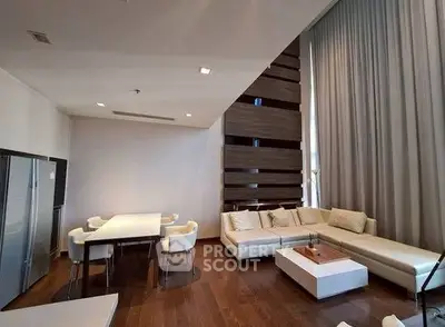 Luxurious modern living room with high ceilings and elegant decor
