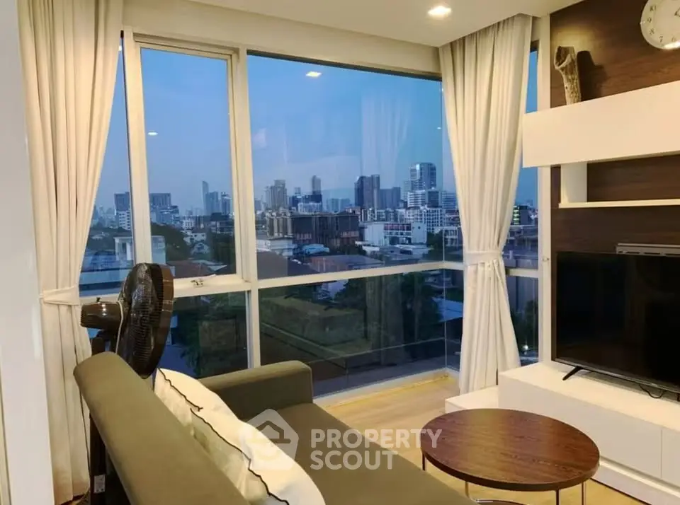 Modern living room with stunning city view and elegant decor