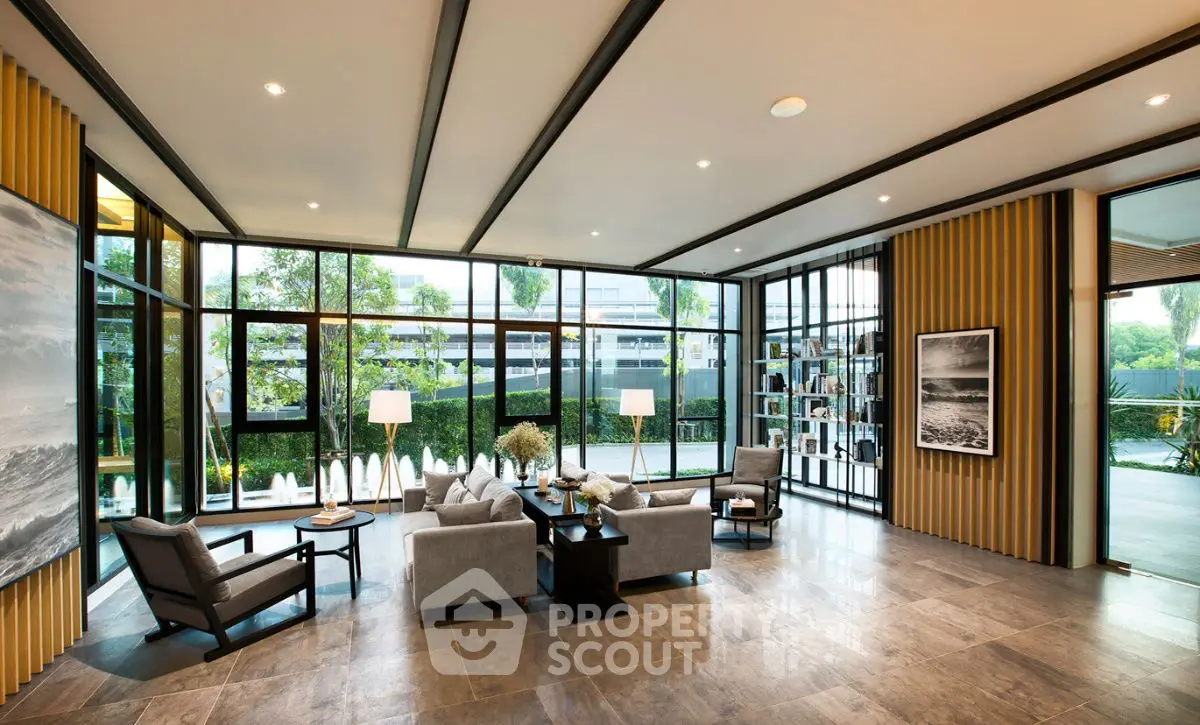 Luxurious modern living room with floor-to-ceiling windows and stylish decor