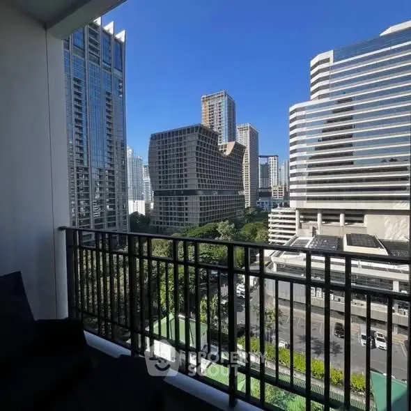 Stunning cityscape view from a modern balcony in a high-rise building.