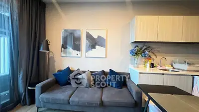 Modern living room with stylish decor and cozy sofa in a contemporary apartment.