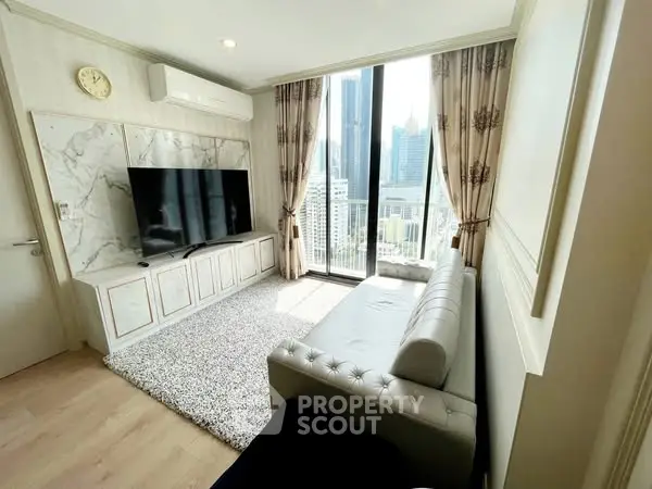 Modern living room with large TV and city view, featuring elegant decor and natural light.