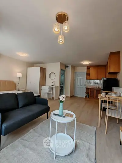 Spacious modern living room with open kitchen and stylish decor