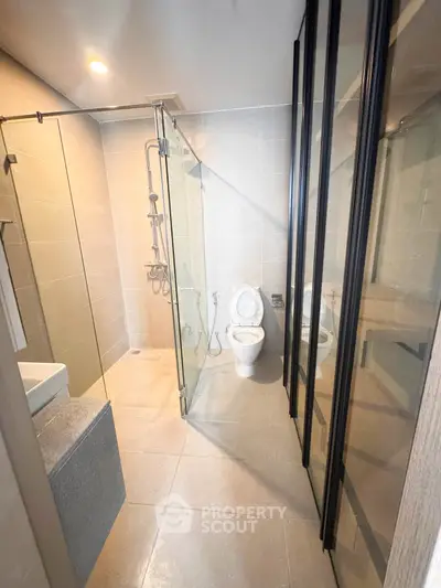 Modern bathroom with glass shower and sleek design