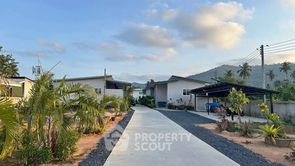 Charming countryside property with modern homes and scenic mountain views, perfect for tranquil living.