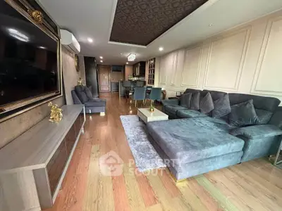 Luxurious living room with elegant decor and spacious seating area in modern apartment.