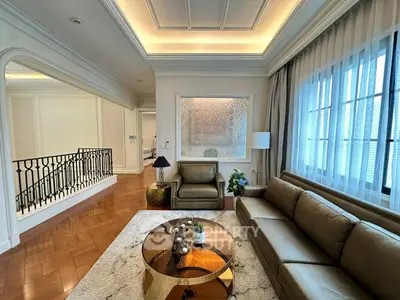 Luxurious living room with elegant decor and stylish furniture in a high-end apartment.