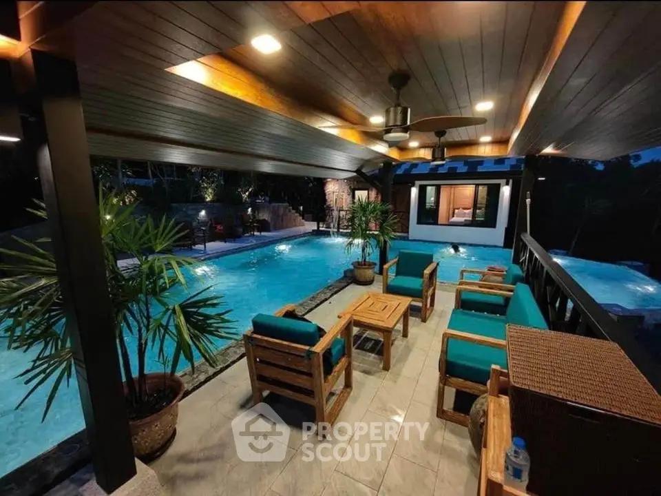 Luxurious poolside patio with elegant seating and ambient lighting