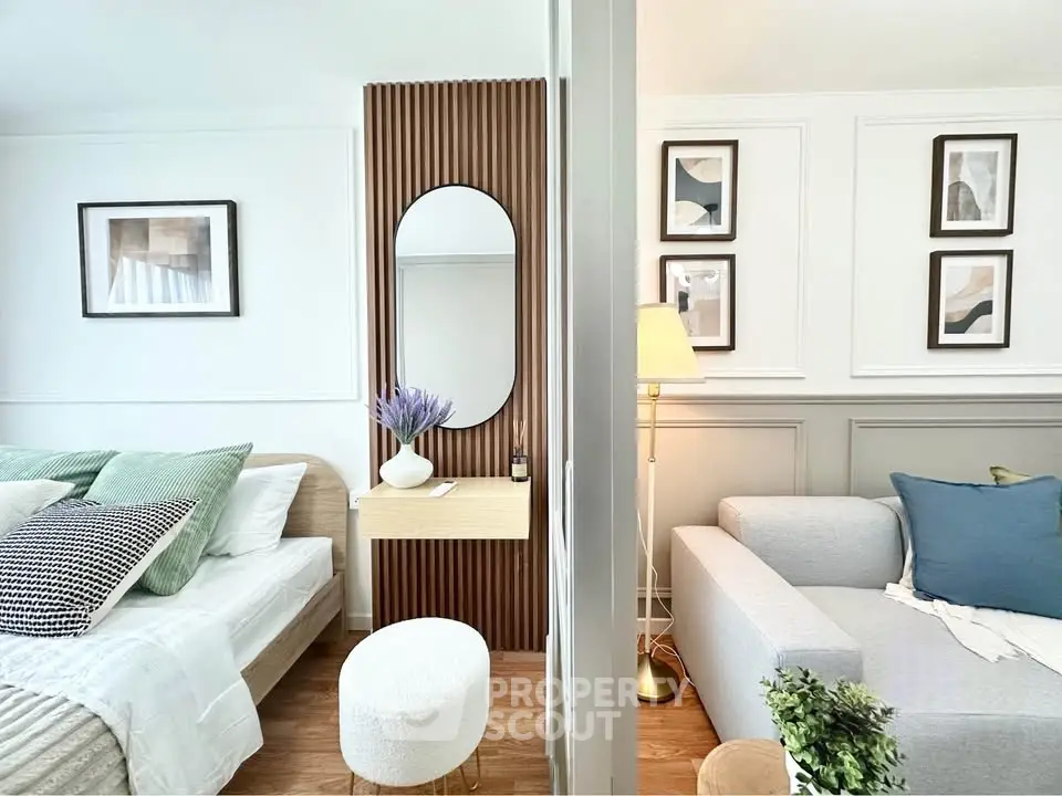 Stylish modern living room with cozy bed, elegant decor, and natural light, perfect for urban living.