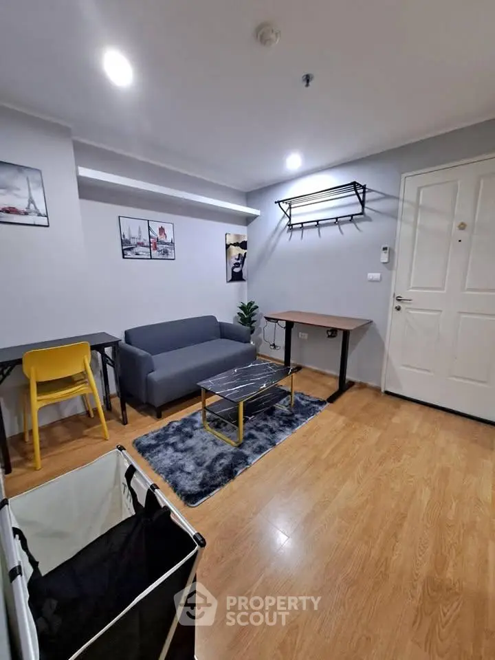 Modern living room with stylish decor and cozy seating area, perfect for relaxation and entertaining.