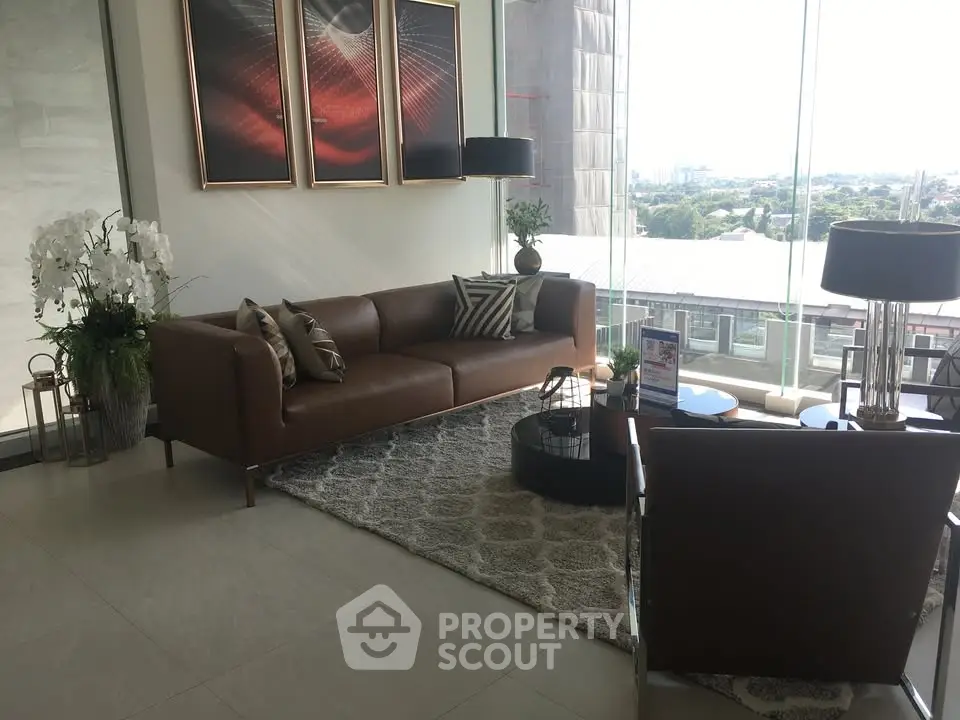 Luxurious living room with modern decor and stunning city view, featuring elegant furniture and stylish artwork.