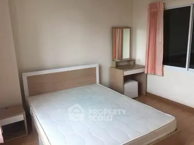 Cozy bedroom with natural light and minimalist furniture