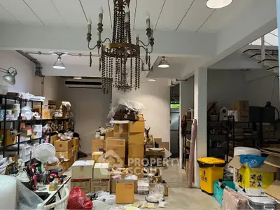Spacious storage room with industrial lighting and organized shelving
