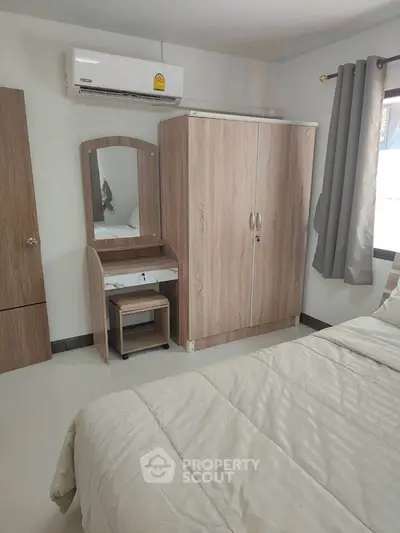 Cozy bedroom with modern wooden furniture and air conditioning