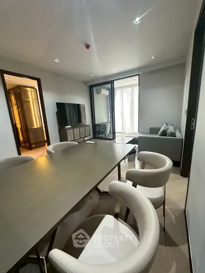 Modern living room with sleek furniture and large window for natural light
