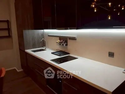 Modern kitchen with sleek cabinetry and built-in appliances