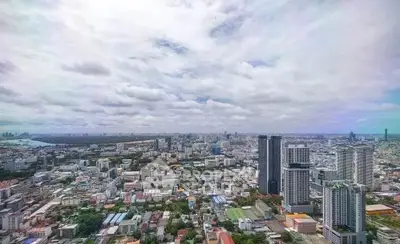 Stunning panoramic cityscape view from high-rise building showcasing urban skyline.