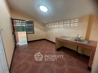 Spacious kitchen with unique tile flooring and ample natural light