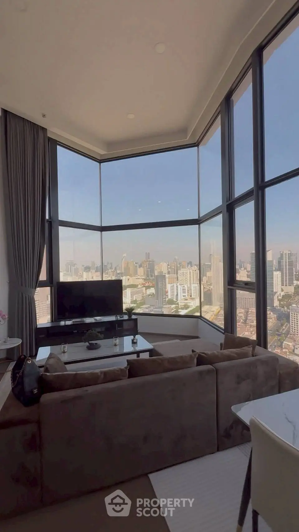 Luxurious living room with panoramic city view and modern decor