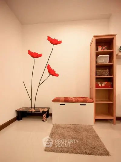Charming interior with floral wall art and cozy seating in a modern home.