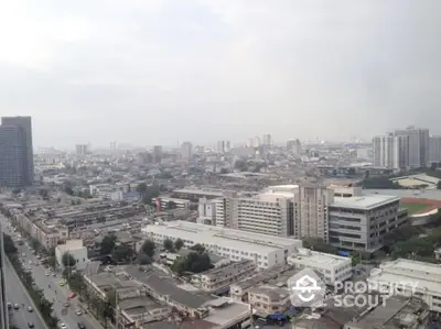 Stunning cityscape view from high-rise building showcasing urban skyline and bustling streets.