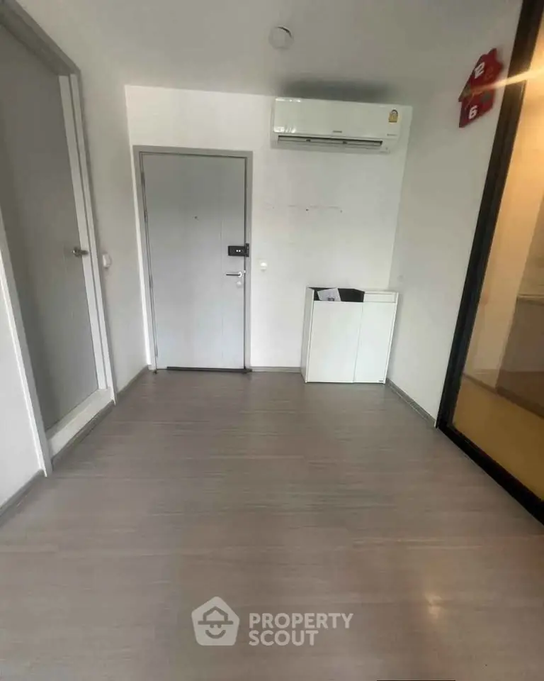 Minimalist interior with air conditioning and sleek flooring, perfect for modern living.