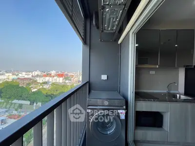 Modern balcony with washing machine and city view in high-rise apartment