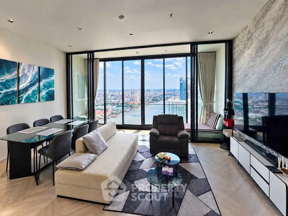 Luxurious living room with stunning city and river view, modern furniture, and elegant decor.